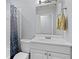 Well-lit bathroom featuring a vanity with a white sink and mirror at 980 Oakton Sw Dr, Marietta, GA 30060