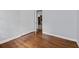 Empty bedroom with hardwood floors and a view into kitchen at 980 Oakton Sw Dr, Marietta, GA 30060