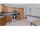 Bright kitchen featuring stainless steel appliances, tiled floors, and ample wood cabinetry at 980 Oakton Sw Dr, Marietta, GA 30060