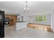 Open-concept kitchen with breakfast bar, modern appliances, and hardwood flooring in the adjacent living area at 980 Oakton Sw Dr, Marietta, GA 30060