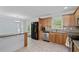 View of the kitchen featuring stainless steel dishwasher and refrigerator with tiled floors at 980 Oakton Sw Dr, Marietta, GA 30060