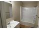 Cozy bathroom featuring a vanity, mirror, and a shower-tub combination at 2888 Mountain View Rd, Snellville, GA 30078