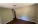Modest bedroom with hardwood floors and a doorway to an adjacent room or closet at 2888 Mountain View Rd, Snellville, GA 30078