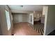 Open kitchen with black and white tile floors, adjacent to dining space and outside access at 2888 Mountain View Rd, Snellville, GA 30078
