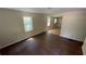 Bright living room featuring hardwood floors and natural light streaming through the large window at 2888 Mountain View Rd, Snellville, GA 30078