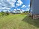Spacious backyard with lush grass and fence at 4935 Bellehurst Ln, Cumming, GA 30040