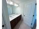 Stylish bathroom with double sink vanity and modern lighting at 4935 Bellehurst Ln, Cumming, GA 30040
