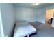 Bedroom with carpet flooring, window, and bathroom access at 4935 Bellehurst Ln, Cumming, GA 30040