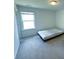 Bedroom featuring natural light, carpet flooring, and window view at 4935 Bellehurst Ln, Cumming, GA 30040