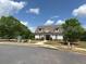 Charming clubhouse with a manicured lawn, offering a welcoming space for community gatherings and events at 4935 Bellehurst Ln, Cumming, GA 30040