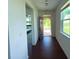 Inviting entryway with dark wood floors leading to an open-concept living space at 4935 Bellehurst Ln, Cumming, GA 30040