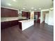 Gourmet kitchen boasts a large island, stainless steel appliances, and beautiful countertops at 4935 Bellehurst Ln, Cumming, GA 30040