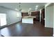 Open kitchen featuring stainless appliances, granite countertops, and large island at 4935 Bellehurst Ln, Cumming, GA 30040