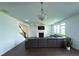 Spacious living room with fireplace, ceiling fan, and plush seating area at 4935 Bellehurst Ln, Cumming, GA 30040