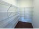 Well-organized pantry with multiple tiers of wire shelving for ample storage in kitchen or dining area at 4935 Bellehurst Ln, Cumming, GA 30040