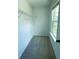 Functional walk-in closet with built-in shelving and a window at 4935 Bellehurst Ln, Cumming, GA 30040