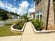 Landscaped garden bed featuring flowering plants and sidewalk at 4935 Bellehurst Ln, Cumming, GA 30040