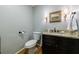 Updated half-bathroom with granite countertops and a modern toilet at 4311 N Elizabeth Se Ln, Atlanta, GA 30339