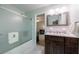 Bathroom featuring glass enclosed shower, marble floors, and a wood cabinet at 4311 N Elizabeth Se Ln, Atlanta, GA 30339
