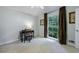 Bright bedroom with a large window, hardwood floors, and versatile space for a desk at 4311 N Elizabeth Se Ln, Atlanta, GA 30339