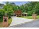 Beautifully landscaped property with mature trees and long private driveway at 4311 N Elizabeth Se Ln, Atlanta, GA 30339