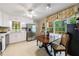 Kitchen featuring stainless steel refrigerator, white cabinets, breakfast nook with big windows at 4311 N Elizabeth Se Ln, Atlanta, GA 30339