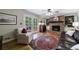 Cozy living room with brick fireplace, built-in bookshelves, and hardwood floors at 4311 N Elizabeth Se Ln, Atlanta, GA 30339