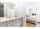 Bathroom with double vanity, modern fixtures, and an open view of the bedroom at 506 Motivation Nw Cir, Atlanta, GA 30309