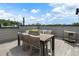 Stylish rooftop deck with dining area, seating, and views of the neighborhood at 506 Motivation Nw Cir, Atlanta, GA 30309