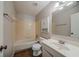 Bathroom with a shower-tub combination and a single sink vanity at 228 Amour Sw Way, Lilburn, GA 30047