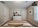 Virtually staged bedroom featuring a dresser and tasteful artwork, enhancing the room's appeal at 228 Amour Sw Way, Lilburn, GA 30047