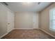 Spacious bedroom with neutral tones, offering versatility for personalized decor and design at 228 Amour Sw Way, Lilburn, GA 30047