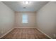 Neutral bedroom offers natural light from the window, creating a calm and inviting space at 228 Amour Sw Way, Lilburn, GA 30047