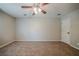 Neutral bedroom features wall-to-wall carpeting and a ceiling fan light fixture at 228 Amour Sw Way, Lilburn, GA 30047