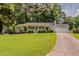 Charming single-story home features a well-maintained lawn and inviting curb appeal at 228 Amour Sw Way, Lilburn, GA 30047