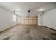 Spacious two-car garage featuring a garage door and overhead lighting at 228 Amour Sw Way, Lilburn, GA 30047