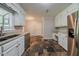 Kitchen boasts stainless steel appliances, a built-in desk and stone tile flooring at 228 Amour Sw Way, Lilburn, GA 30047