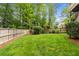 Spacious backyard features lush green grass and a wood fence at 2871 Parkridge Ne, Brookhaven, GA 30319