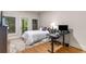 Bedroom features a cozy bed, a desk, and access to a private balcony with scenic views at 2871 Parkridge Ne, Brookhaven, GA 30319