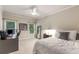 Bedroom featuring a bed, a desk, and carpet floors complemented by tree views at 2871 Parkridge Ne, Brookhaven, GA 30319
