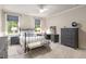 Comfortable bedroom with neutral walls, carpet floors, and plenty of natural light at 2871 Parkridge Ne, Brookhaven, GA 30319
