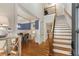 Elegant foyer with hardwood floors, staircase, and views into the dining room at 2871 Parkridge Ne, Brookhaven, GA 30319
