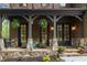 Charming front porch with stone accents, seating, and hanging plants at 2871 Parkridge Ne, Brookhaven, GA 30319