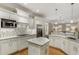 Bright kitchen features white cabinetry, stainless steel appliances, granite countertops, and a decorative backsplash at 2871 Parkridge Ne, Brookhaven, GA 30319