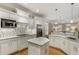 Bright kitchen with white cabinets, granite countertops, and stainless steel appliances at 2871 Parkridge Ne, Brookhaven, GA 30319