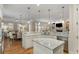 Open concept kitchen with island seating and views to the dining and living areas at 2871 Parkridge Ne, Brookhaven, GA 30319