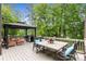 Outdoor dining area featuring comfortable seating, dining table, grill, and a gazebo for shade at 2871 Parkridge Ne, Brookhaven, GA 30319
