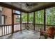 Cozy screened-in porch features slate tile flooring and views of the lush backyard at 2871 Parkridge Ne, Brookhaven, GA 30319