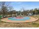 Community splash pad with colorful design, surrounded by seating and landscaping at 2871 Parkridge Ne, Brookhaven, GA 30319