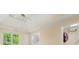 Bright bedroom featuring a tray ceiling, and a view of the outdoors at 3270 Golfe Links Dr, Snellville, GA 30039